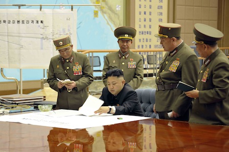 North Korean leader Kim Jong Un, center, discussing strategic plans with military personnel. Source: Reuters